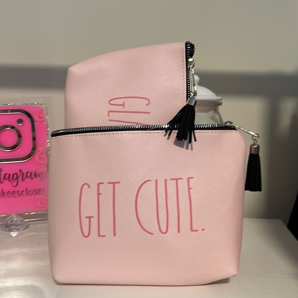 ⭐️RAE DUNN MAKEUP BAGS “GET CUTE” “GLAM” written in black on a pink backgr…